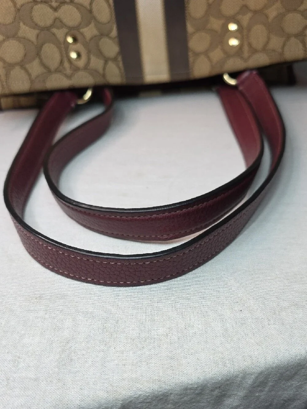 Coach Dempsey Signature Tote with Orange Medallion and Burgundy Trim